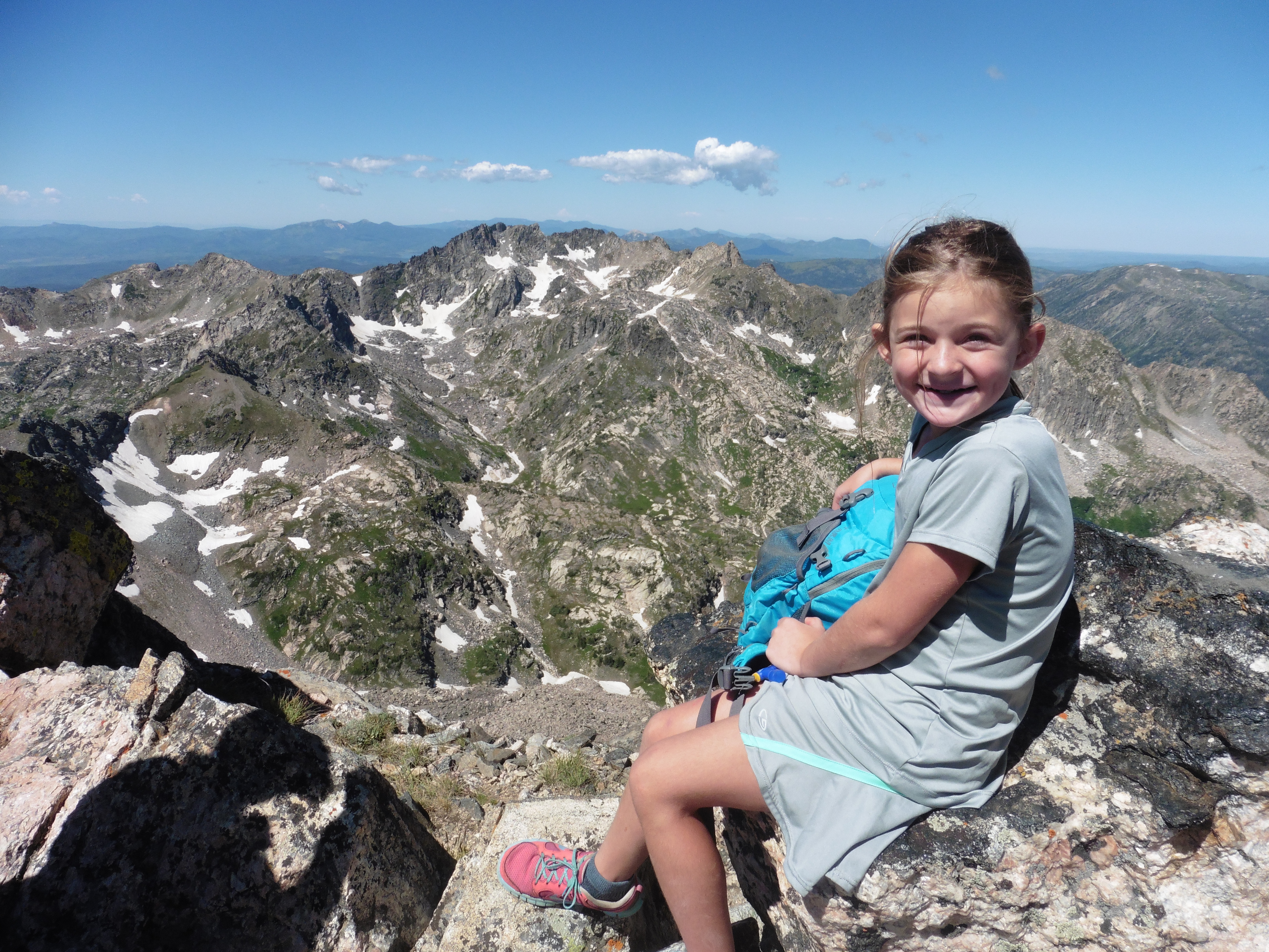 Atop her first alpine summit